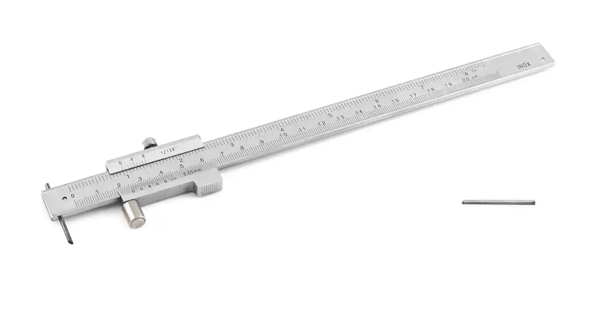 A metal scribing tool with a sharp point and a sliding measurement scale, used for marking precise lines on metal surfaces.